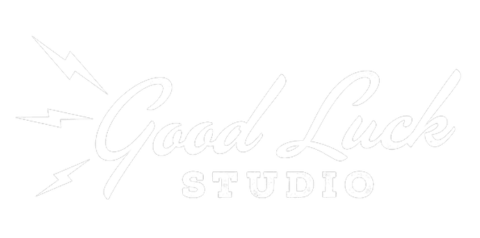 A black and white photo of the good life studio logo.