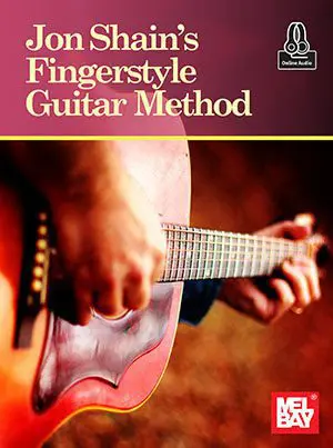 A person playing an instrument on the cover of a book.